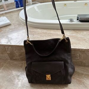 Louis Vuitton monogram Empreinte leather Métis two way hobo. Brown leather